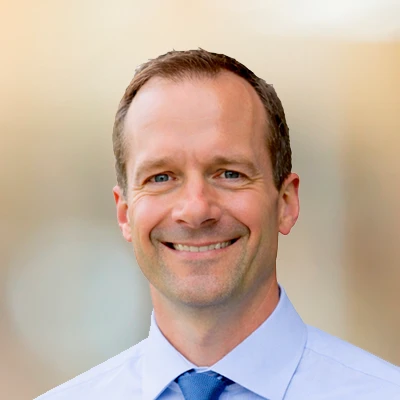 A headshot of Dr. Adam Williams, a chiropractor at The Optimal Health Chiropractic.