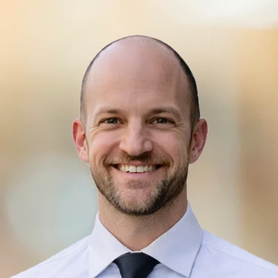 A headshot of Dr. Matthew Monaghan, a chiropractor at The Optimal Health Chiropractic.